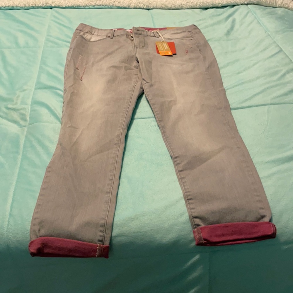 Grey jeans with a hint of purple, rips (the style)